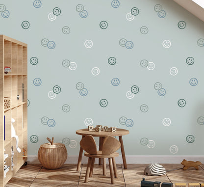Play corner under a sloped ceiling with Smiley Confetti wallpaper in blue
